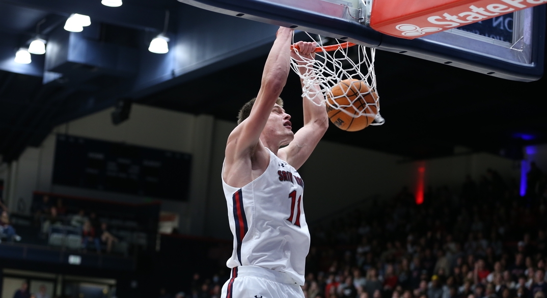 A Saint Mary's basketball player dunking