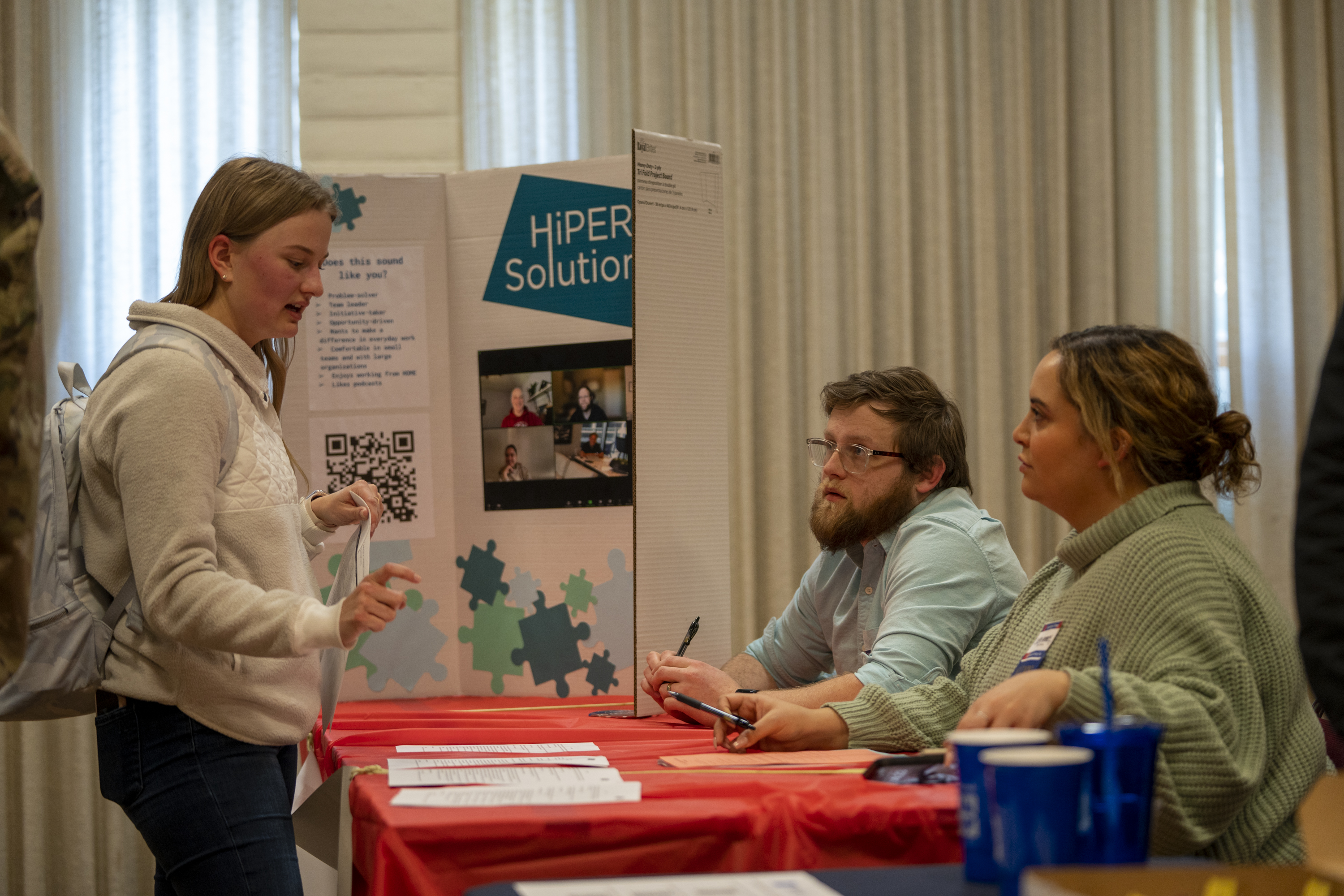 Student talking to HiPER Solutions reps