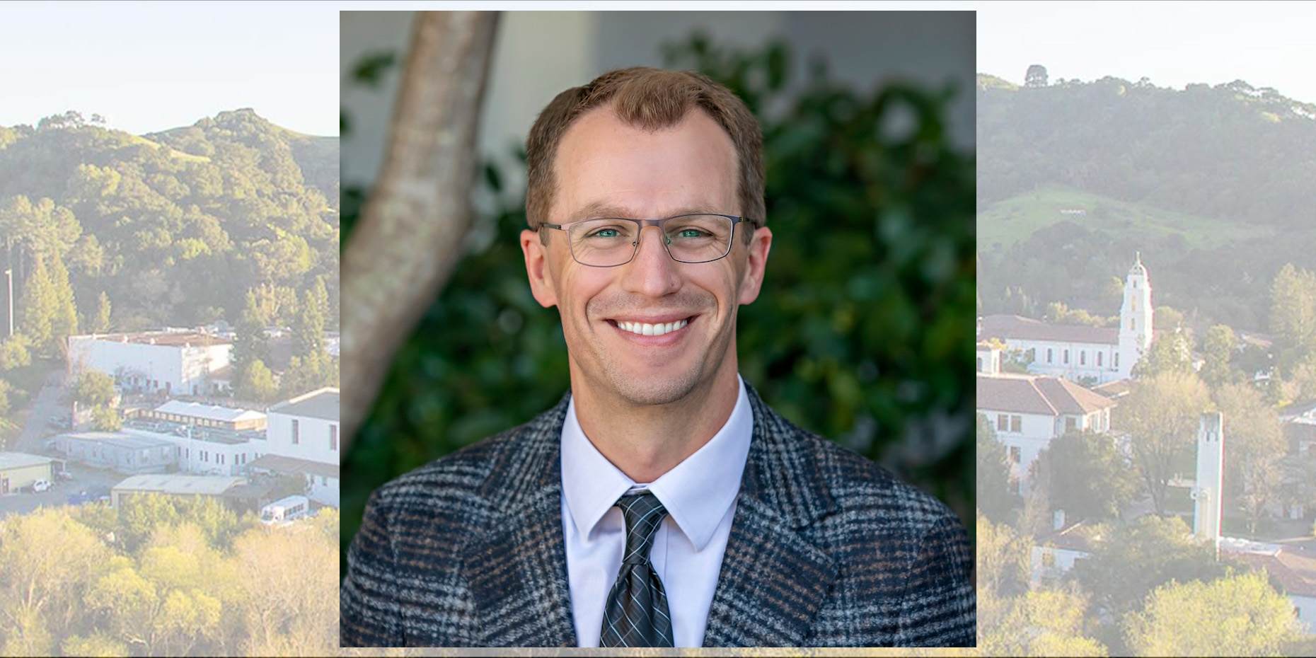 Business faculty member Grant Rozeboom with screened-in image of campus behind him