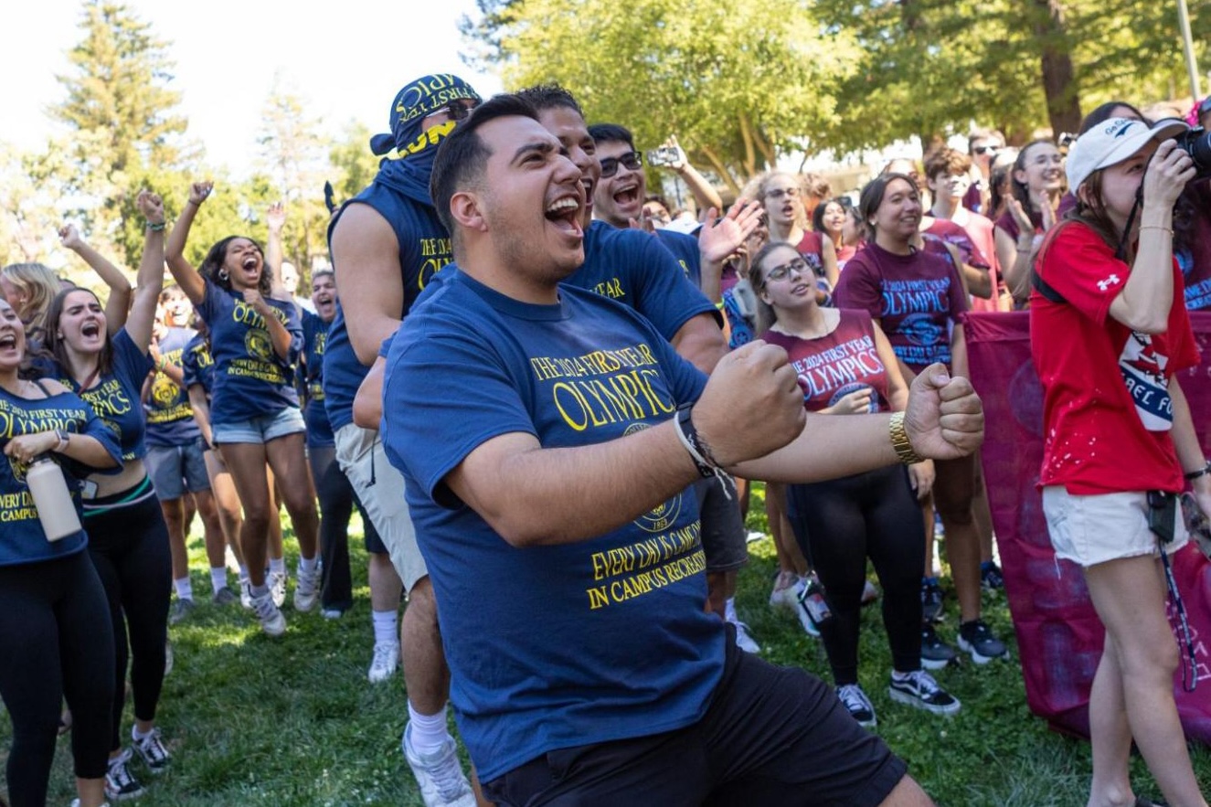 Student Jose Miranda '26 cheering at first year olympics