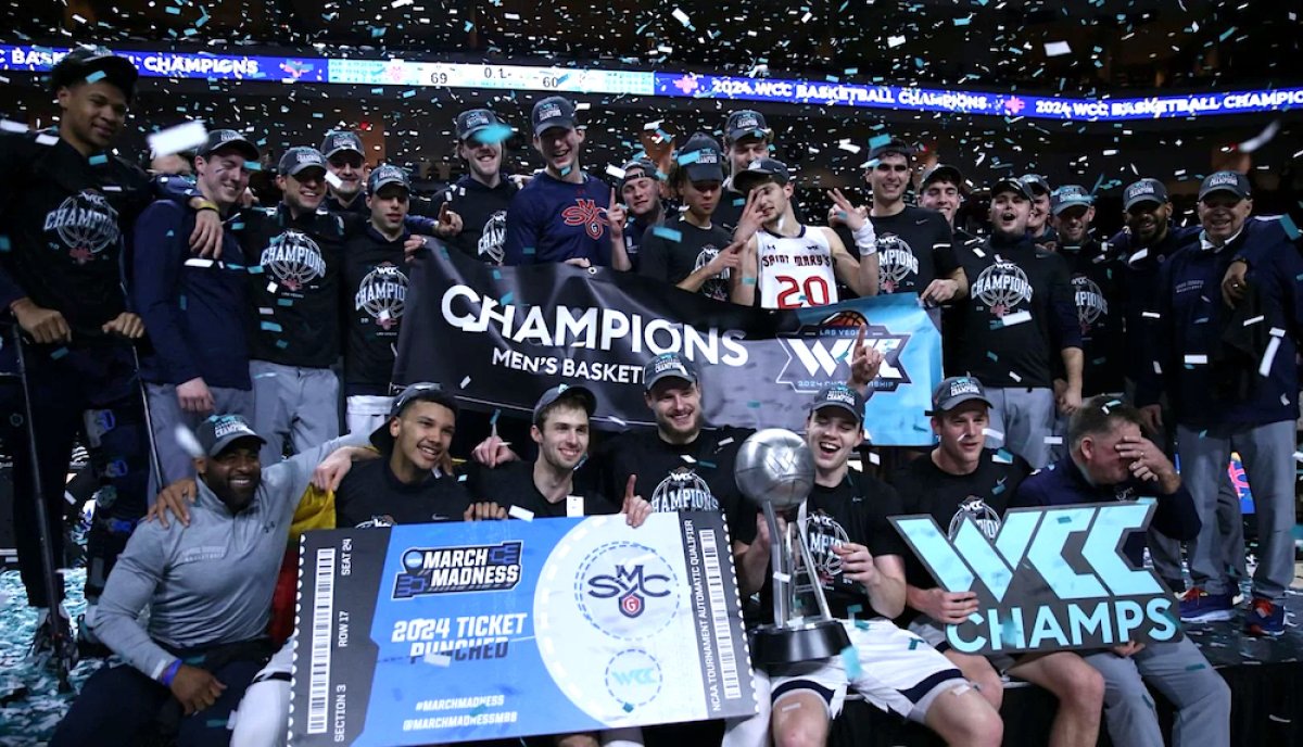 Men's Basketball players celebrate WCC Tournament Championship victory in March 2024