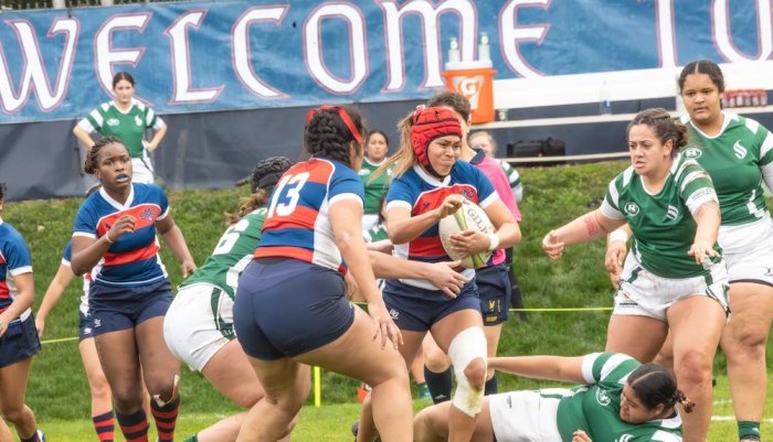 Saint Mary's women's rugby players carry the ball