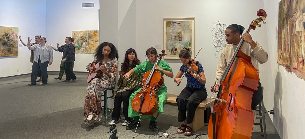 Ensemble Assemblage students playing music in the galleries 