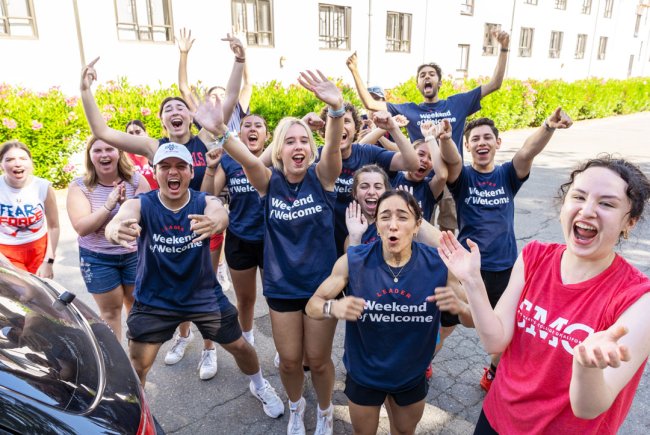 Students cheering at Saint Mary's College wearing Weekend of Welcome Shirts