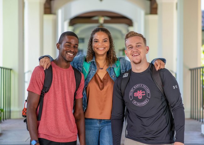 Saint mary's college students standing together smiling