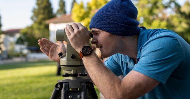 A student looking through a telescope