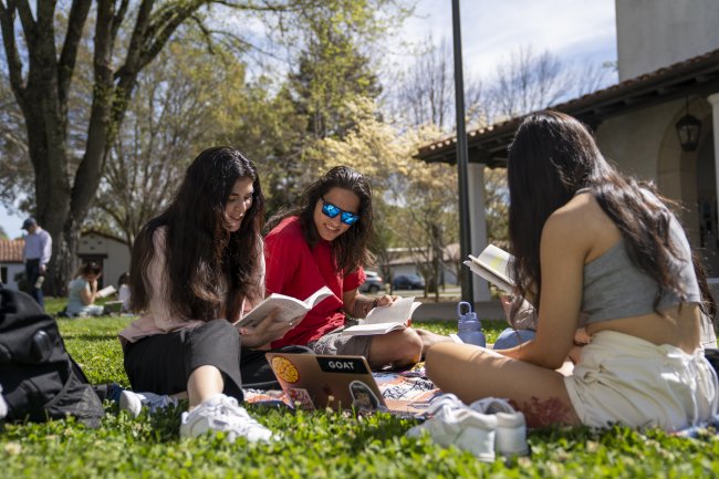 Three students in outdoor genetics class