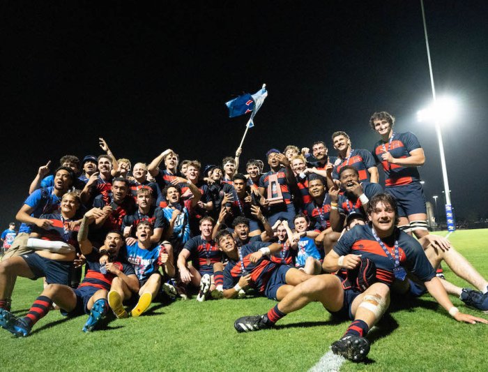 SMC Men's Rugby poses for a group photo on the pitch after winning 2024 National Championship