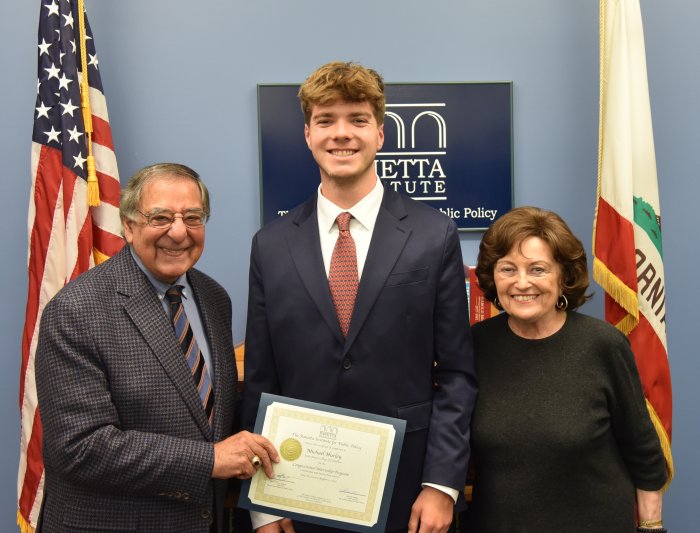 Leon and Sylvia Panetta and Michael Hurley '26 pose for a photo