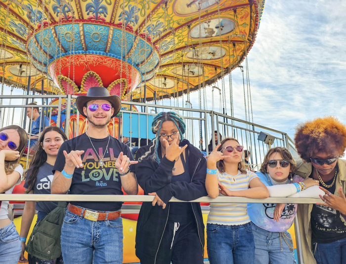 Far Out: Gael beach goers pose for a quick photo while waiting in line to ride the Sea Swings at the Santa Cruz Beach Boardwalk on Sunday, Sept 15. / Photo Courtesy of Hector Garcia ‘28